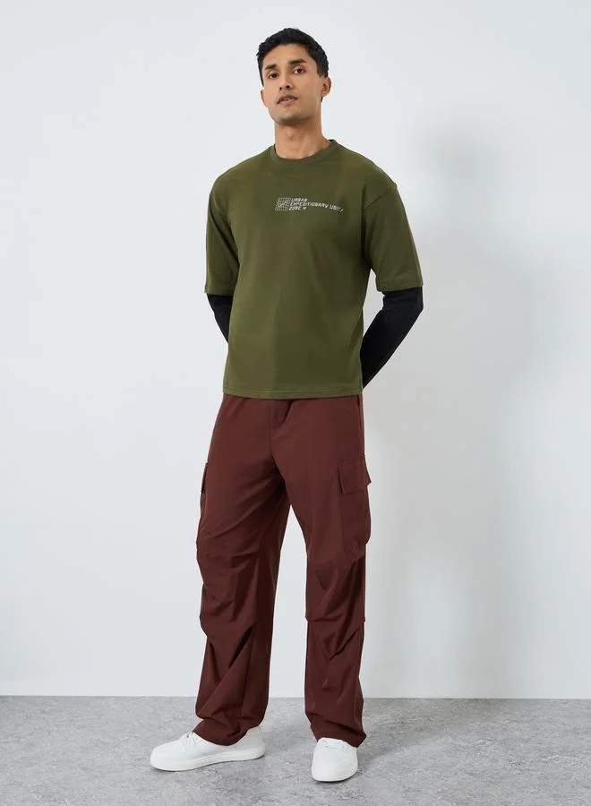 ستايلي تيشيرت واسع بتصميم أكمام مزدوجة